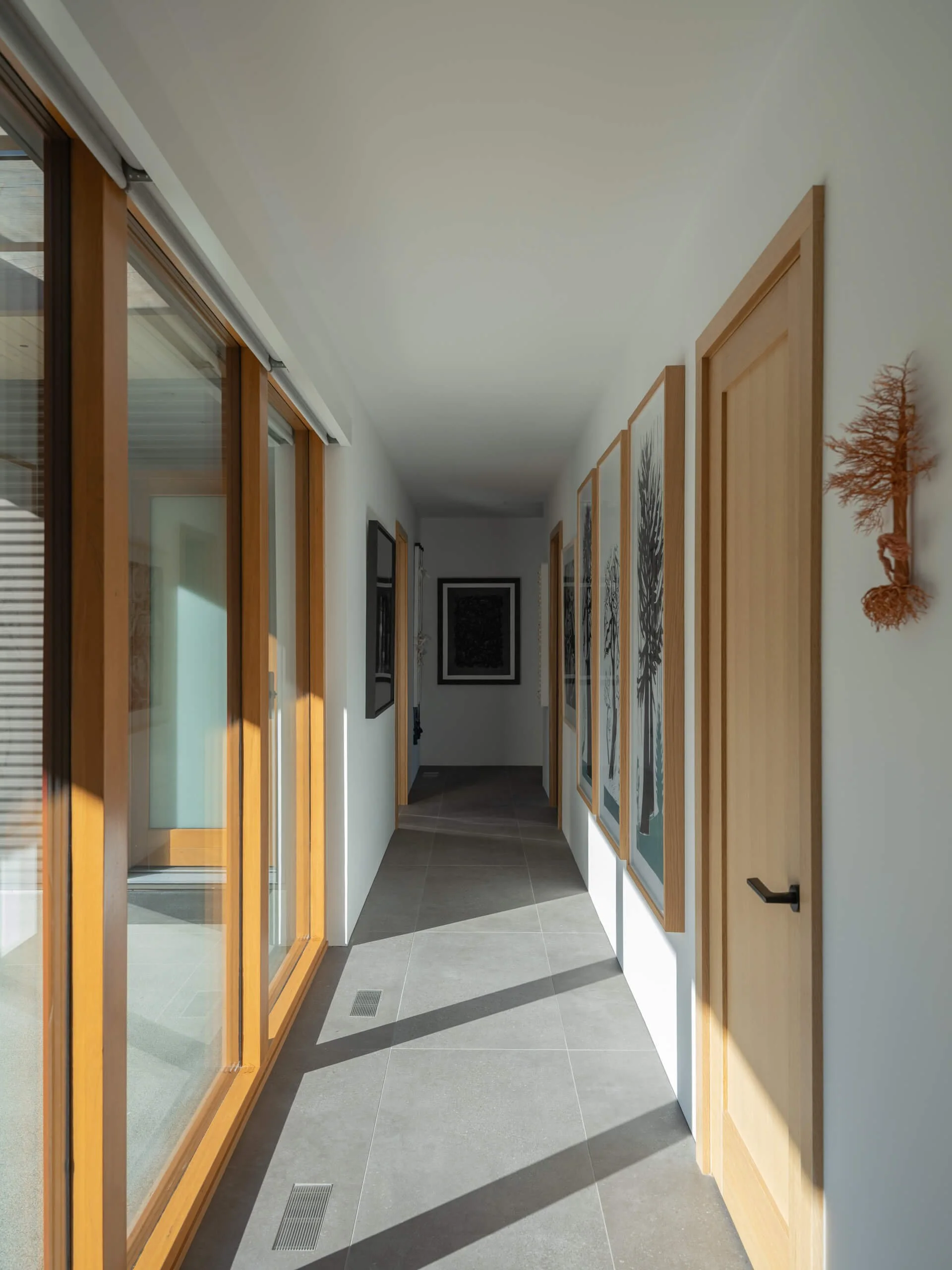salt-spring-island-residence-gallery-corridor-with-artwork-architectural-photographer-matt-anthony.jpg