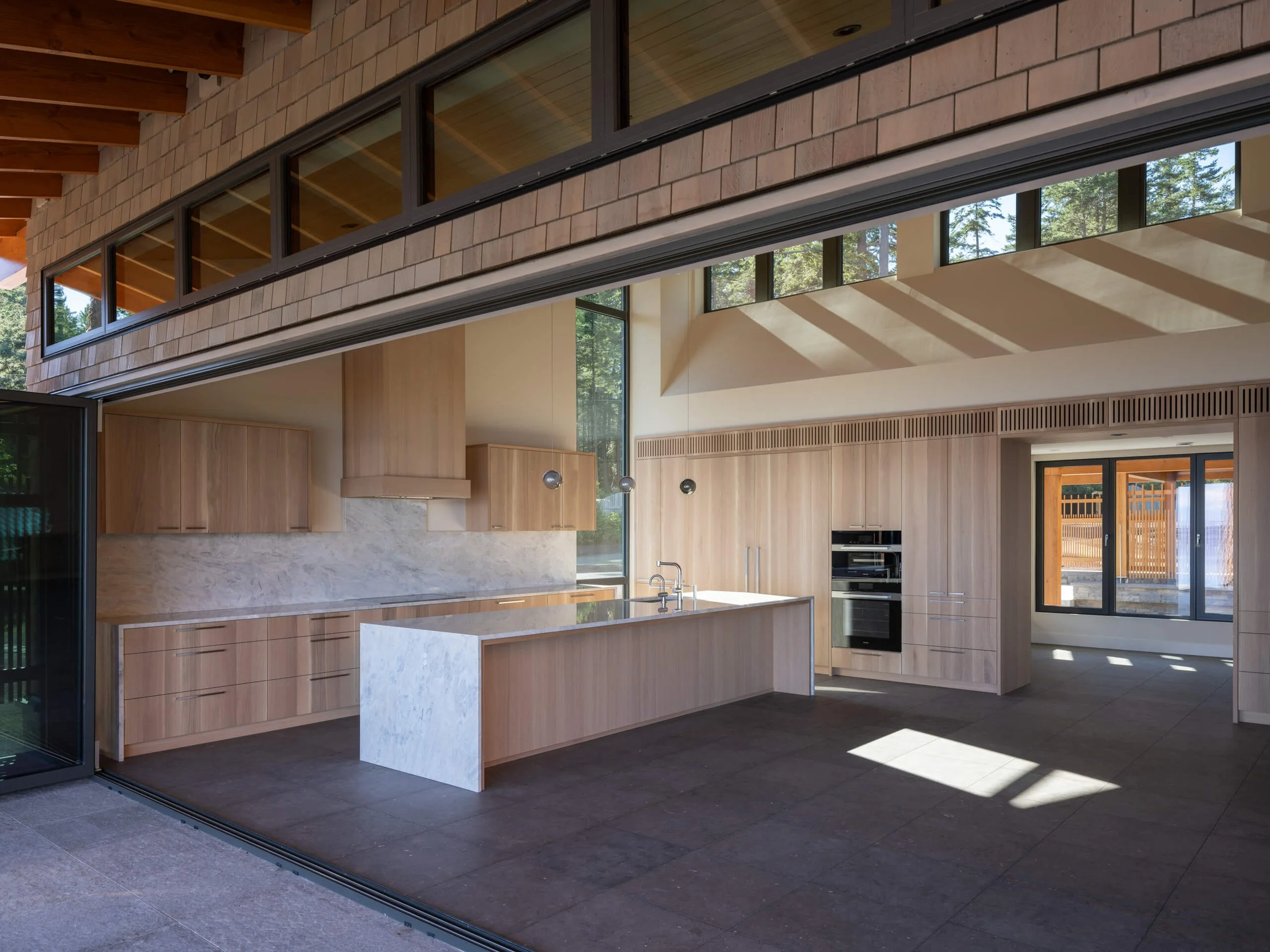 desolation-sound-residence-kitchen-through-the-open-glass-wall-architectural-photographer-matt-anthony.jpg