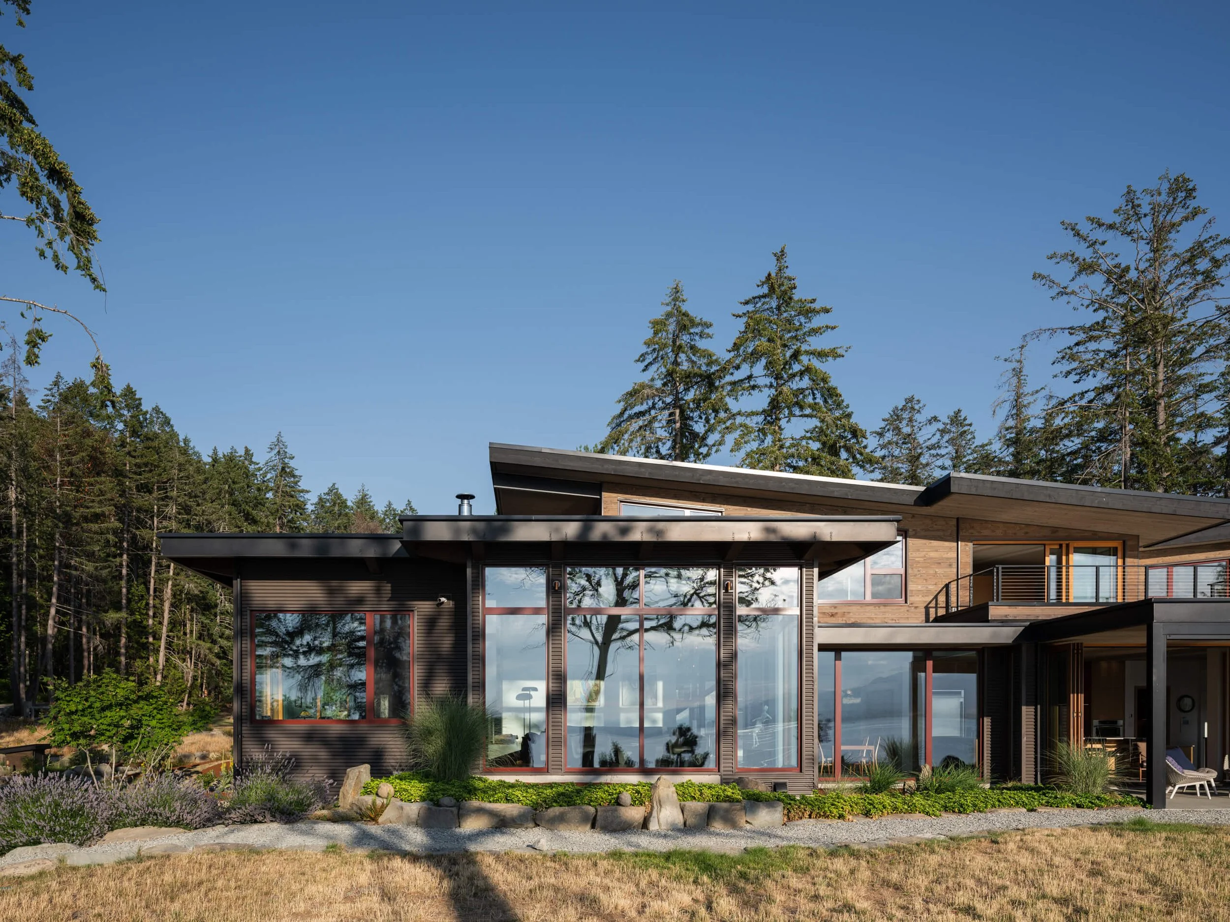 salt-spring-island-residence-meadow-elevation-red-framed-glazing-architectural-photographer-matt-anthony.jpg