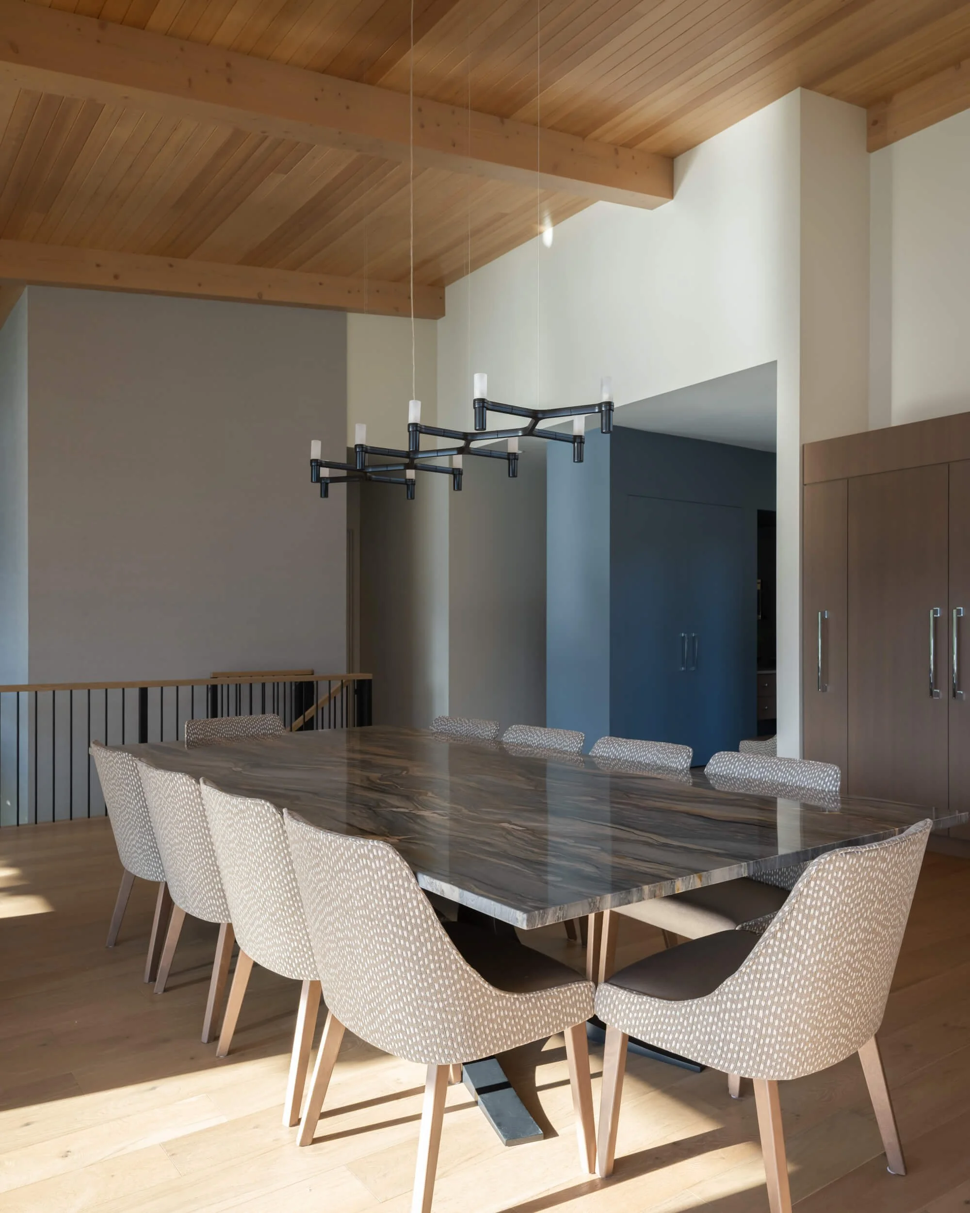 schmidt-residence-invermere-dining-room-stone-slab-table-architectural-photographer-matt-anthony.jpg