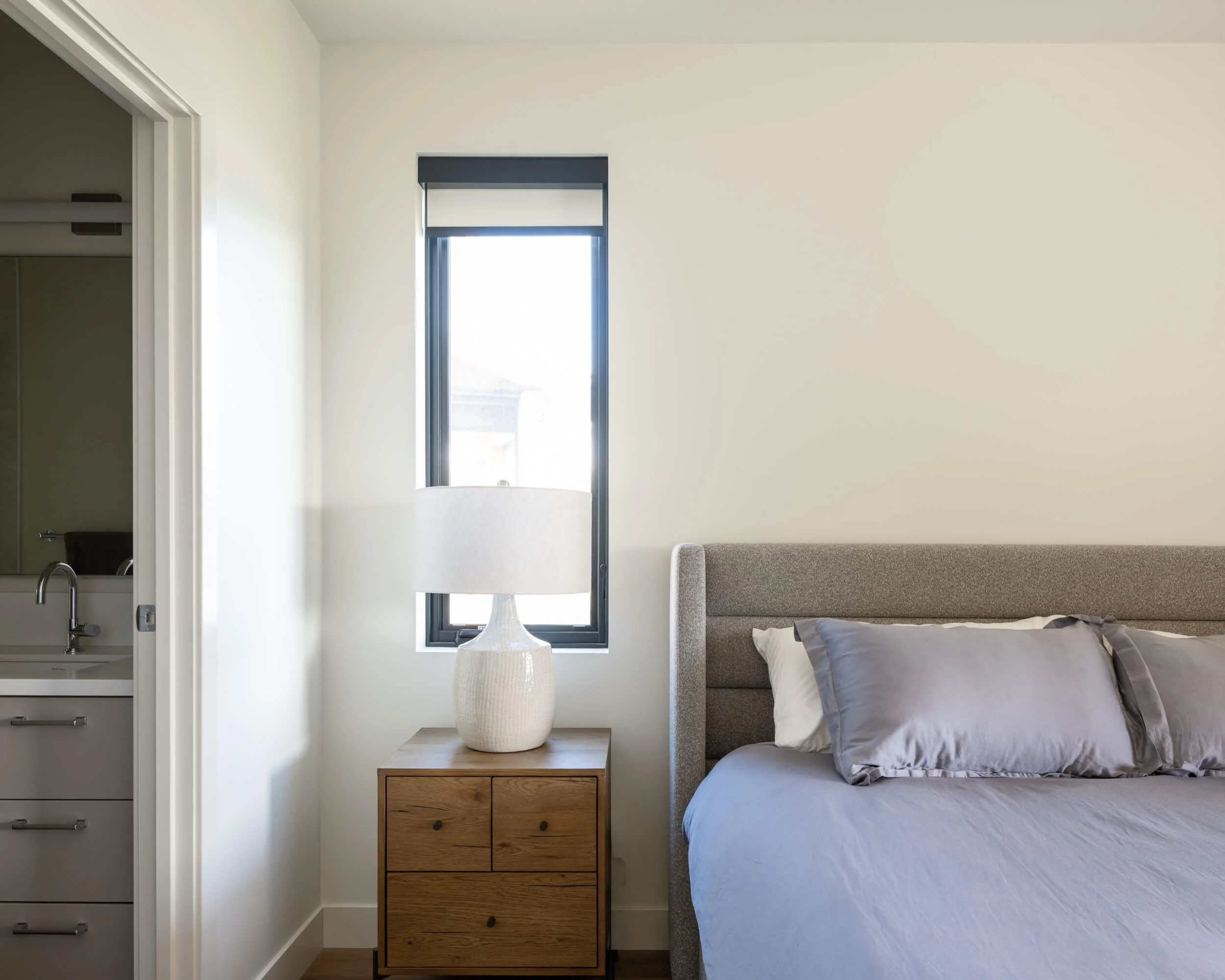 schmidt-residence-invermere-bedroom-corner-black-framed-window-architectural-photographer-matt-anthony.jpg