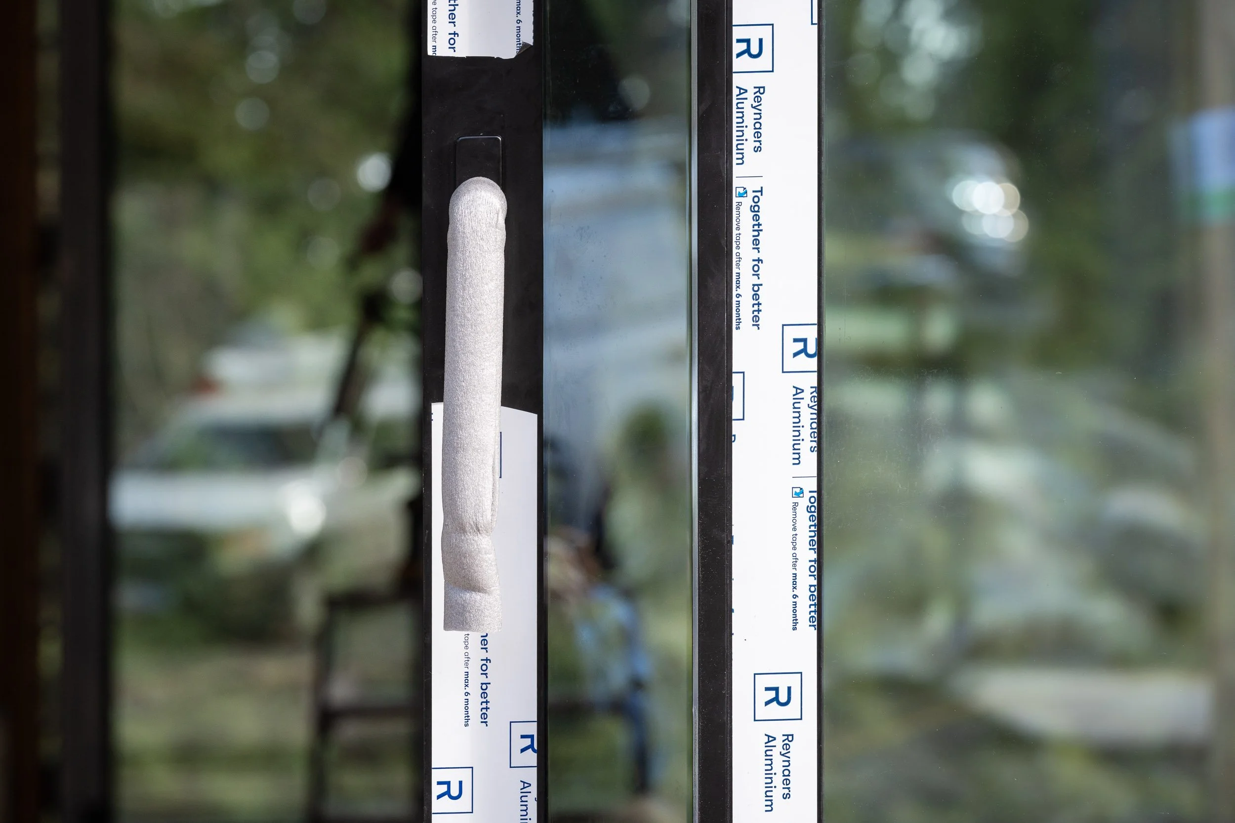 Window Merchant installation detail showing craftsmanship during construction phase