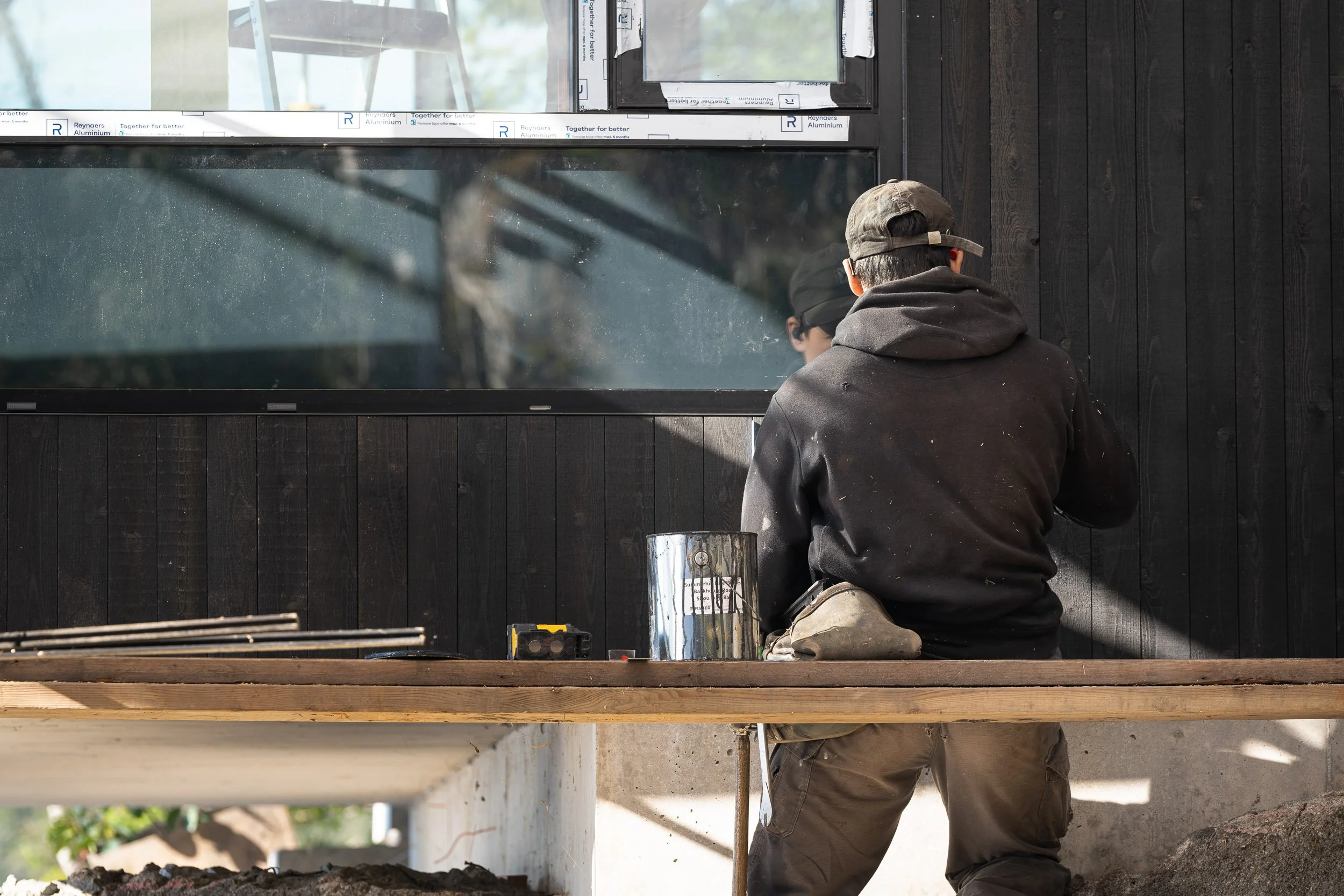 Construction lifestyle photography showing Summerhill Fine Homes crew at work on the Sunshine Coast