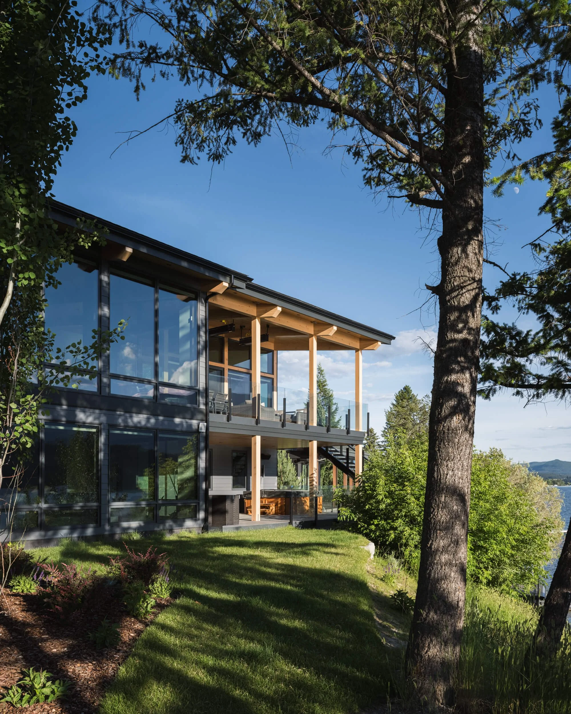 schmidt-residence-invermere-through-the-trees-lakeside-view-architectural-photographer-matt-anthony.jpg