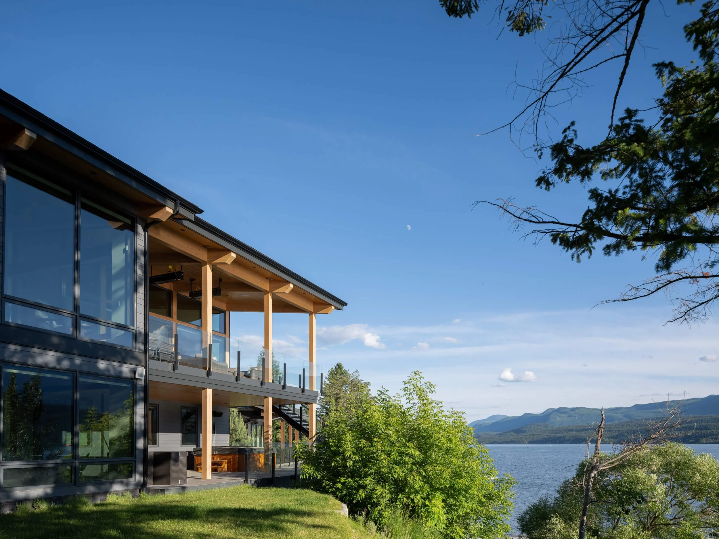schmidt-residence-invermere-lakeside-elevation-daytime-moon-architectural-photographer-matt-anthony.jpg