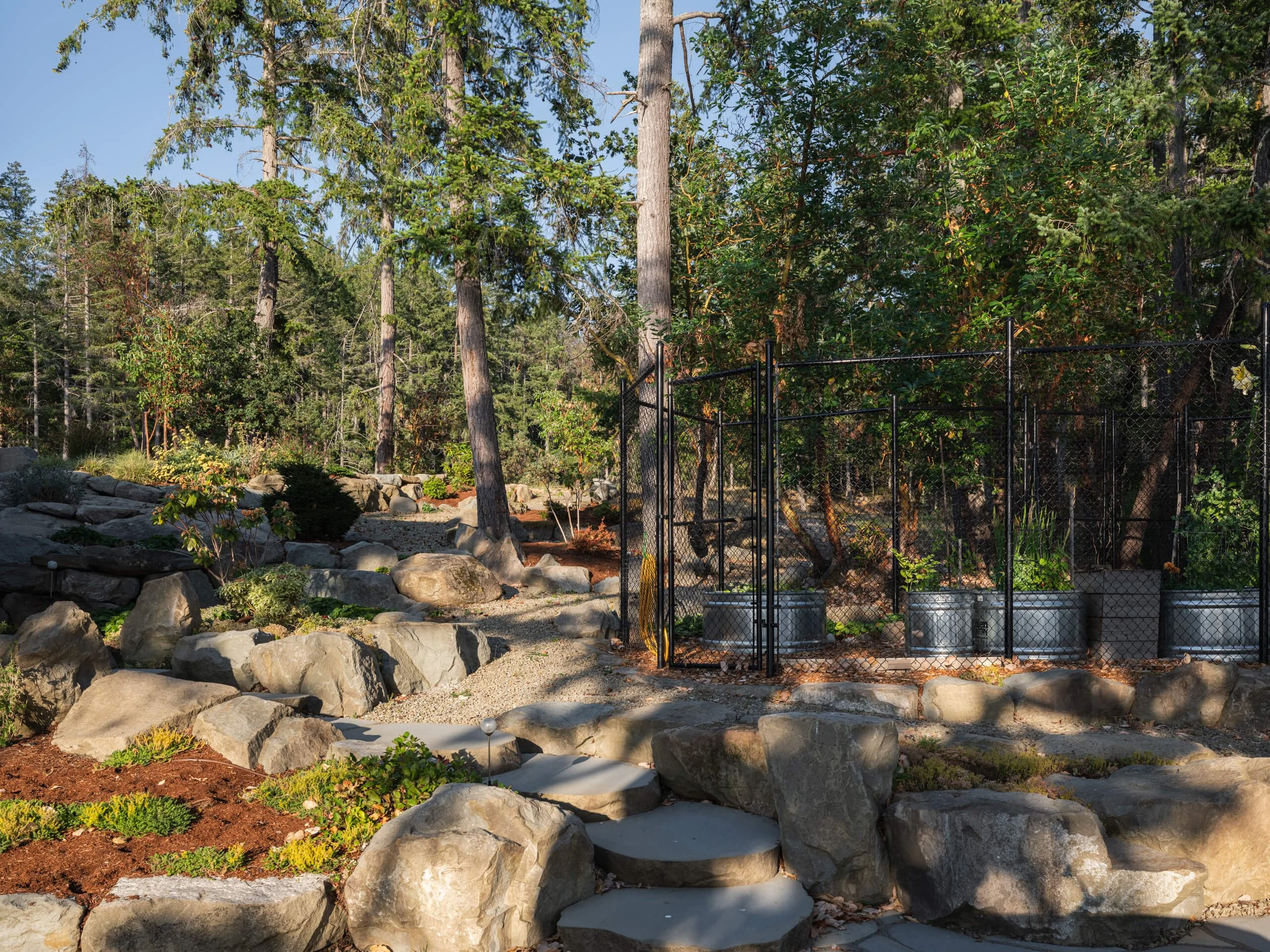 salt-spring-island-residence-fenced-vegetable-garden-stock-tanks-architectural-photographer-matt-anthony.jpg