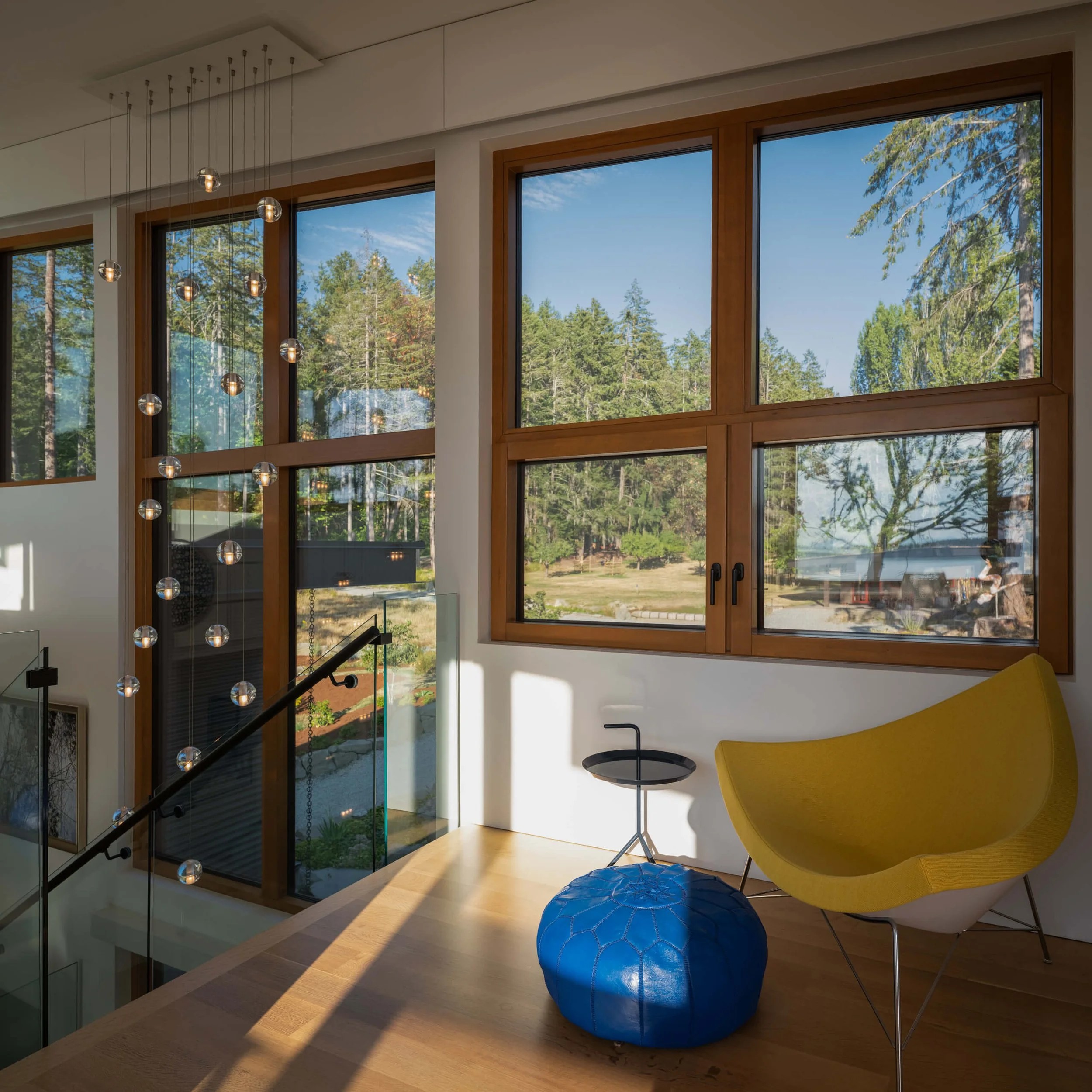 salt-spring-island-residence-stair-landing-cascading-pendants-architectural-photographer-matt-anthony.jpg