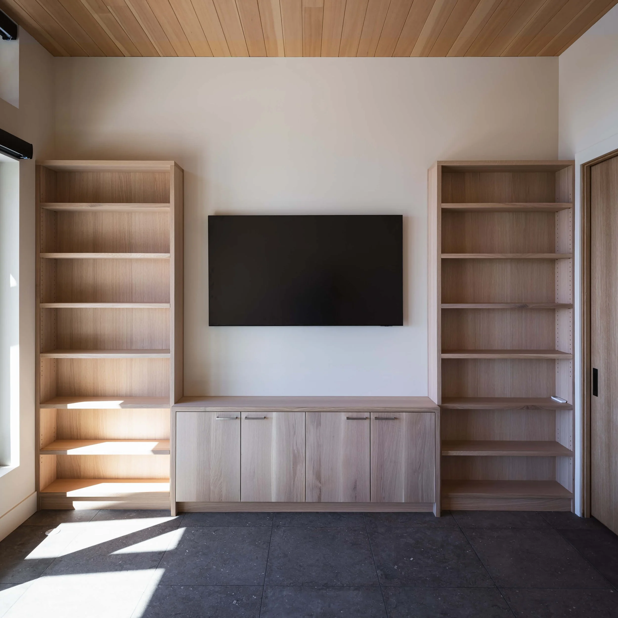 desolation-sound-residence-built-in-oak-shelving-media-wall-architectural-photographer-matt-anthony.jpg