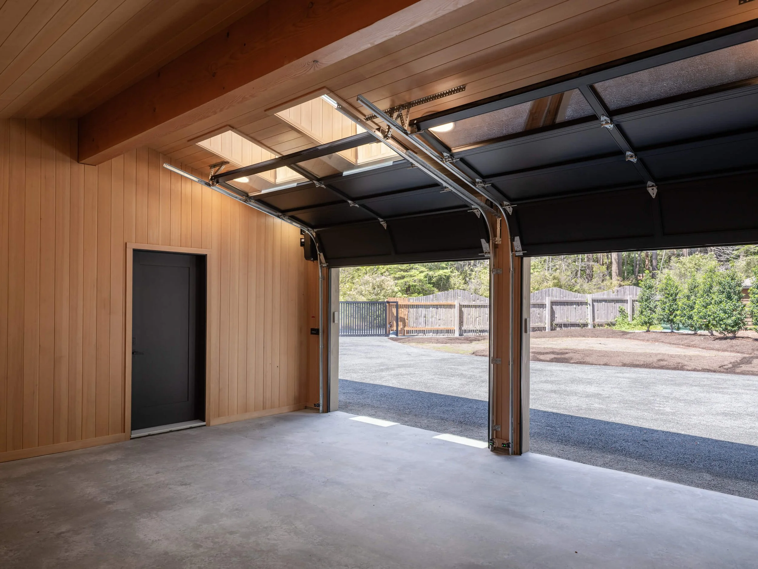 desolation-sound-residence-garage-open-door-to-the-orchard-architectural-photographer-matt-anthony.jpg