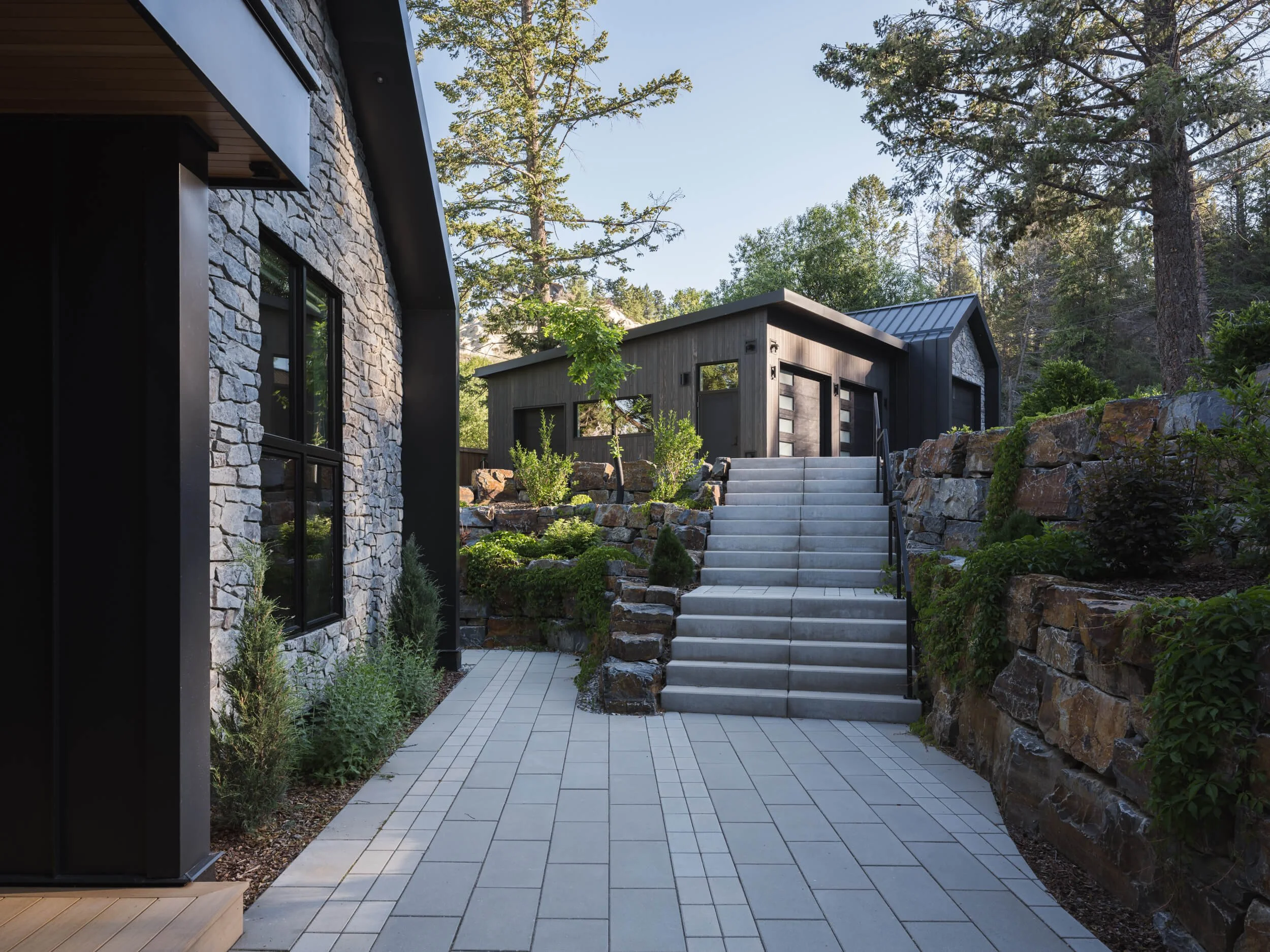 coleman-residence-invermere-courtyard-stairs-boulder-walls-architectural-photographer-matt-anthony.jpg
