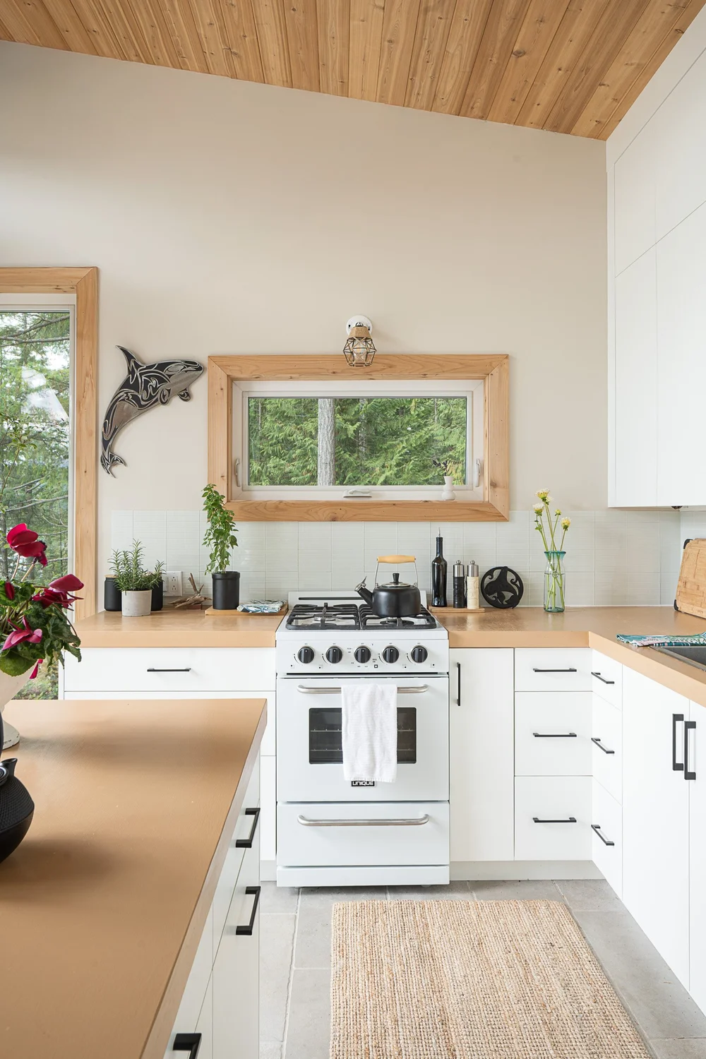 Across the island to the range, an orca cut out on the wall beside the window