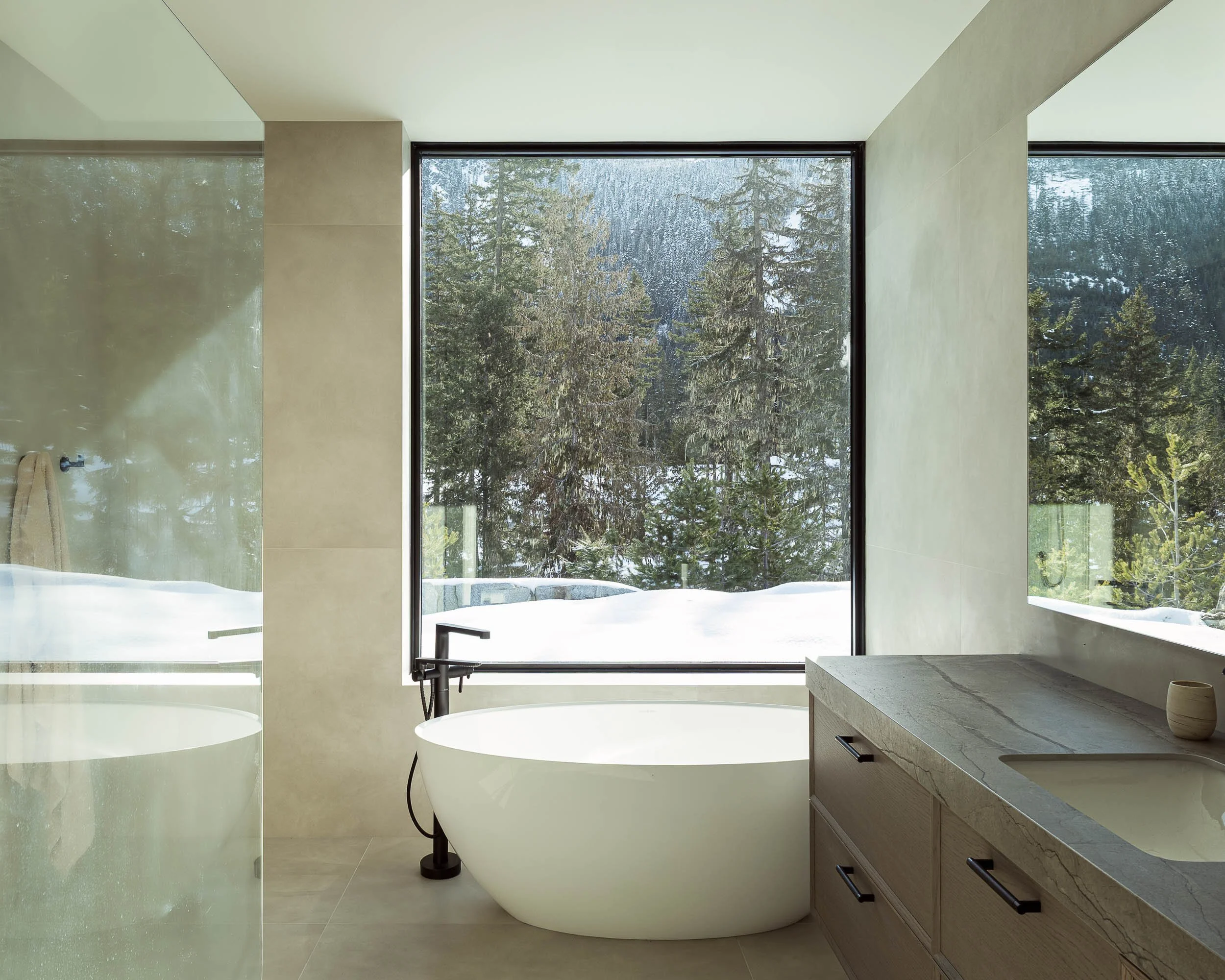 Warbler Residence outdoor deck and living space with mountain views in warm afternoon light