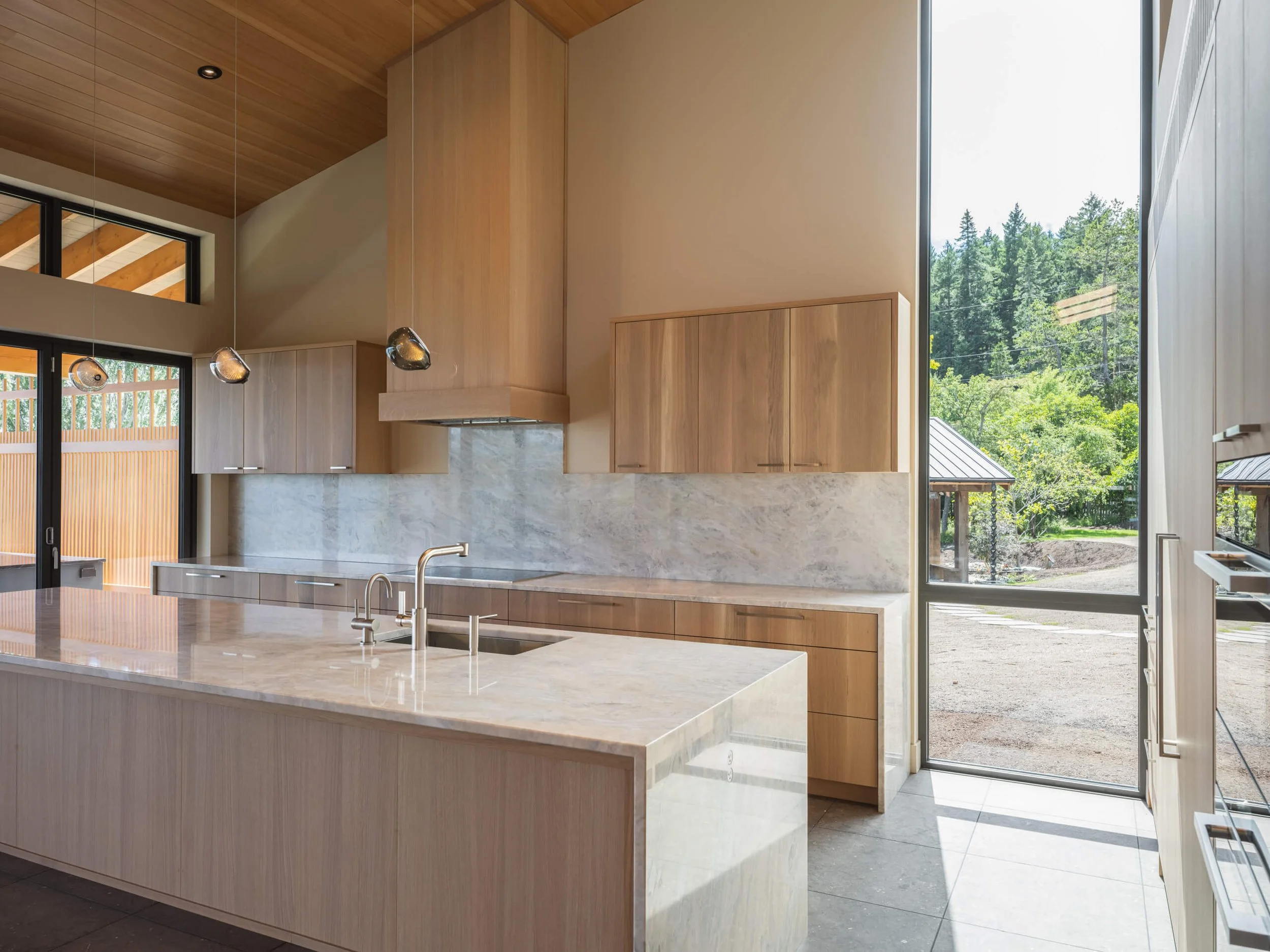 desolation-sound-residence-kitchen-marble-waterfall-island-architectural-photographer-matt-anthony.jpg