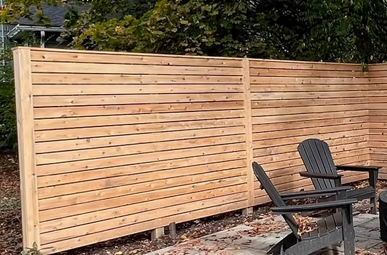 Select Series W502 wood fence with modern horizontal slats and natural cedar tone in Essex County, NJ