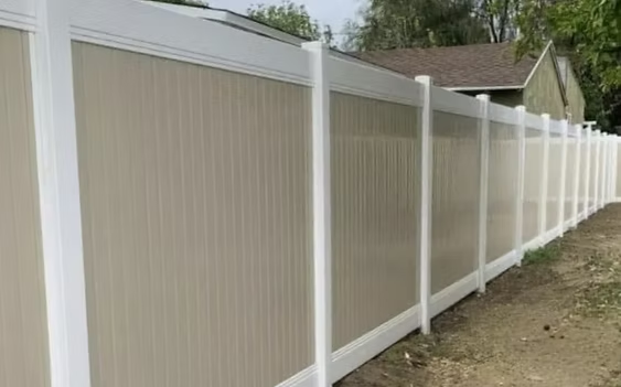 Select Series V100 Two Tone vinyl privacy fence with beige panels and white posts in Essex County, NJ