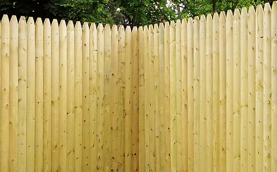 Select Series W305 wood picket fence with rounded tops and light natural finish in Essex County, NJ