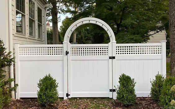 Select Series V101 With Small Square Lattice vinyl fence with compact lattice detail near garden in Pequannock, NJ