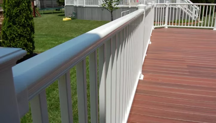 Titan vinyl railing on raised platform designed for durability in Bergen County, NJ
