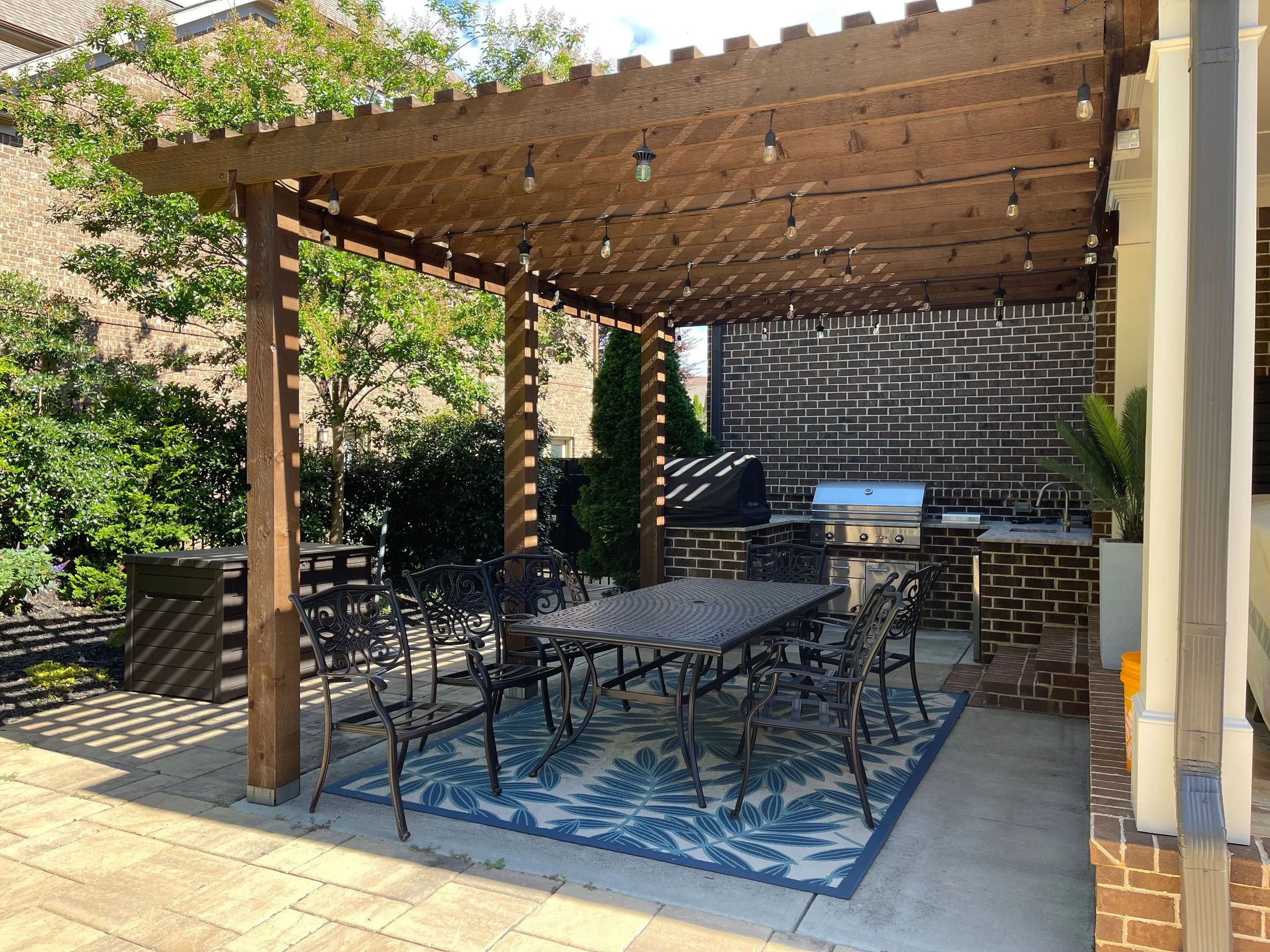Custom outdoor kitchen and covered patio dining space for backyard entertaining in Duluth, GA