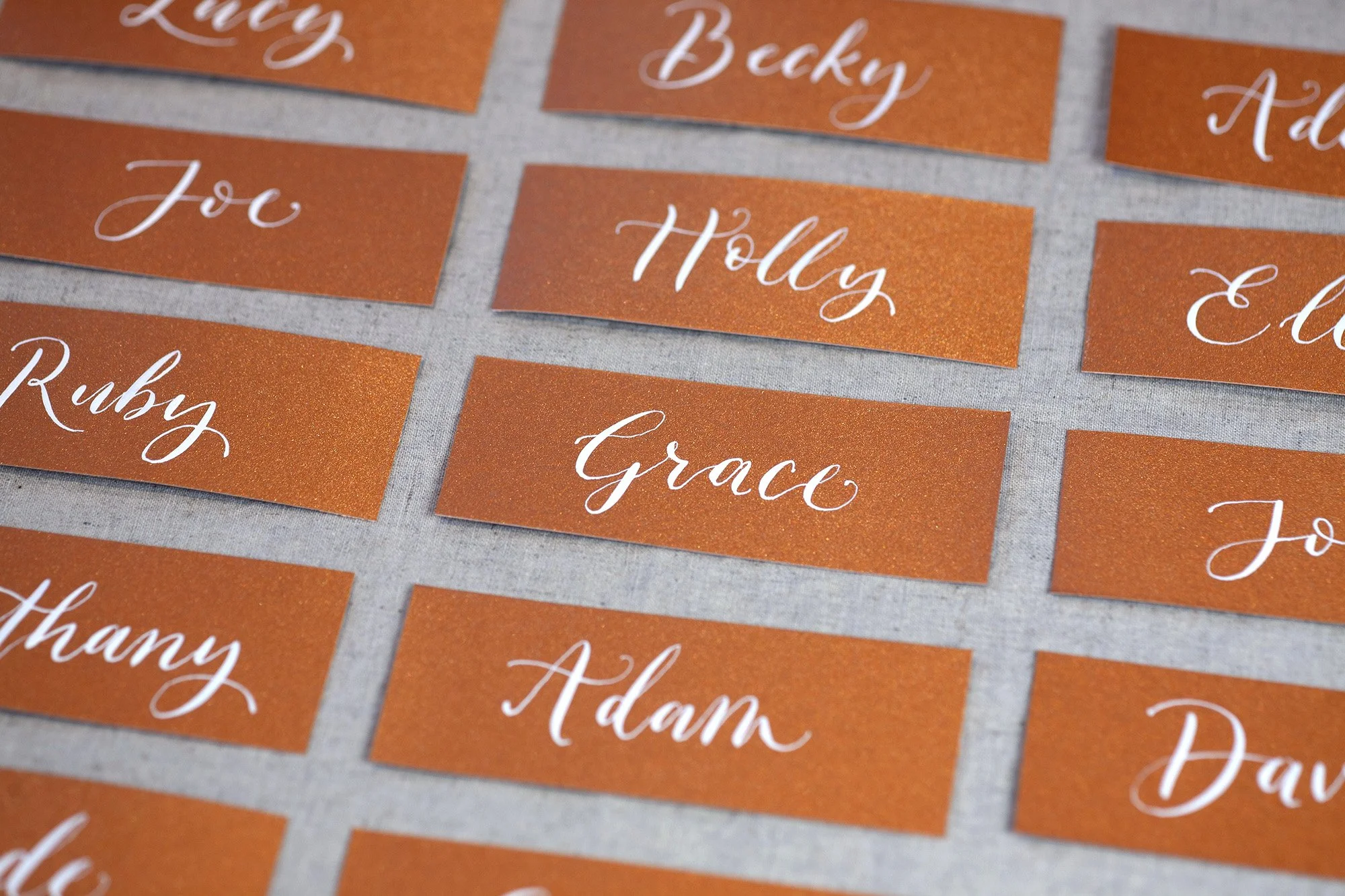 White-ink-on-orange-metallic-placenames.jpg