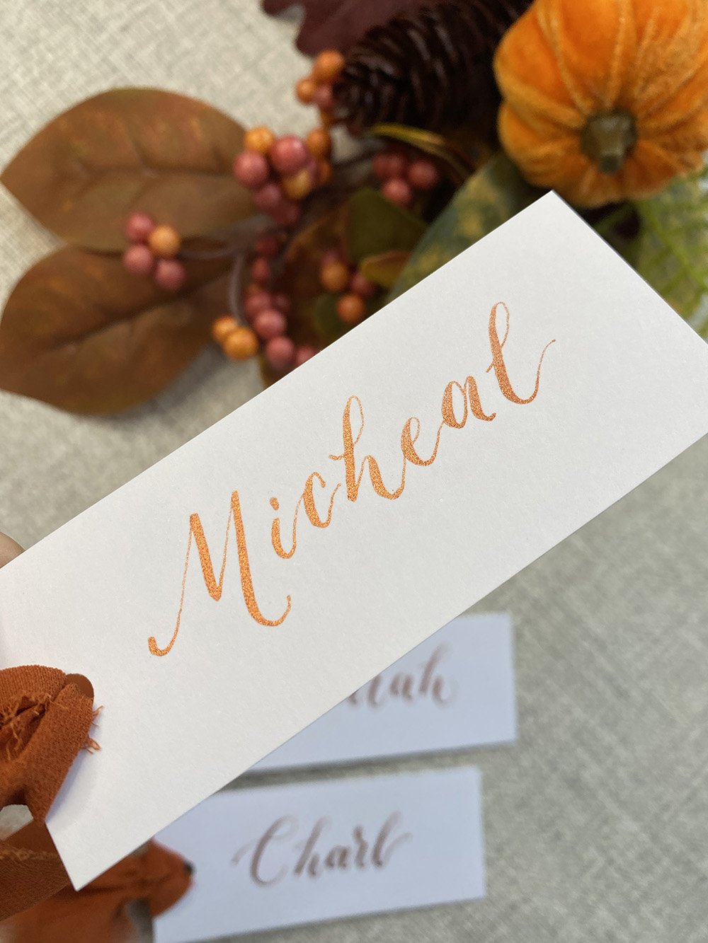 Copper-calligraphy-place-cards-on-white.jpg