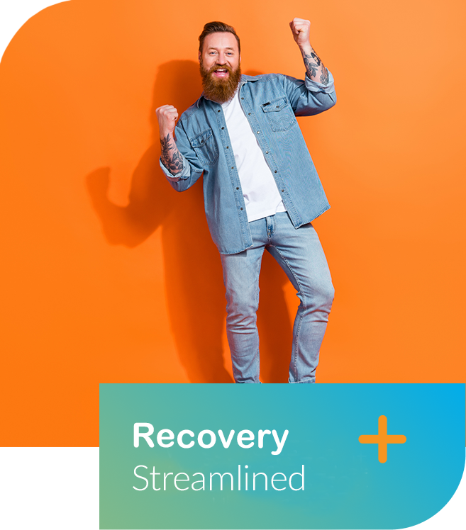 A smiling man with a red beard celebrating, wearing a denim jacket and jeans, standing against an orange background with a teal banner at the bottom that reads "Recovery Streamlined".