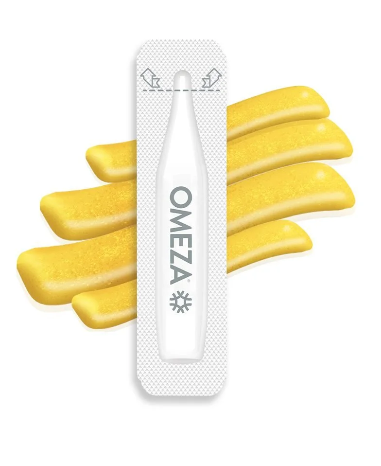 A thermometer with the brand name 'OMEZÁ' in front of sliced bananas.