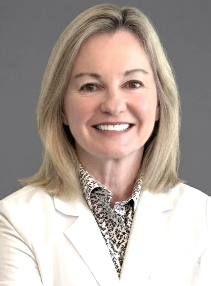 A professional headshot of team member Carol Scroggins