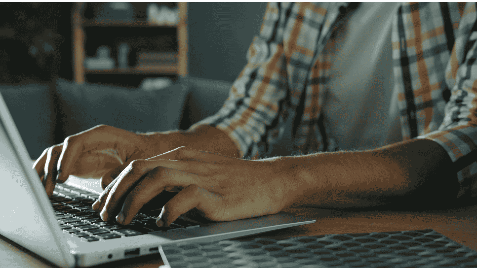 man typing on his computer