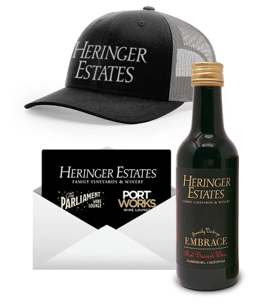 Three trucker hats with 'Heringer Estates' logo, overlayed with red text 'Coming Soon'