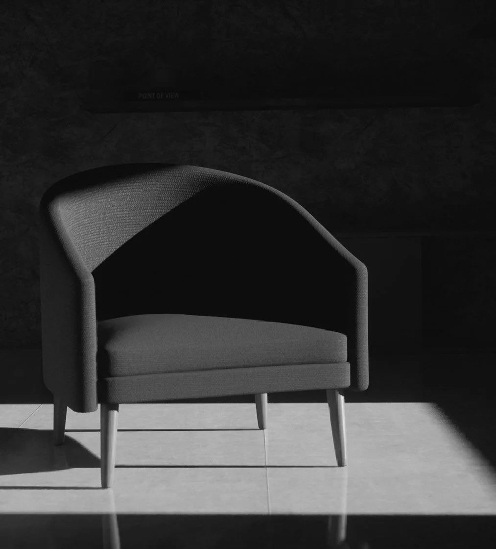 A black-and-white photo of an armchair with wooden legs, placed on a tiled floor, with light casting shadows on the floor.