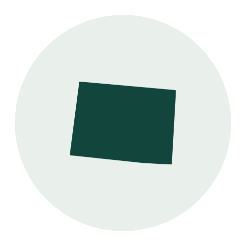 A black square tilted at an angle on a white circular background.