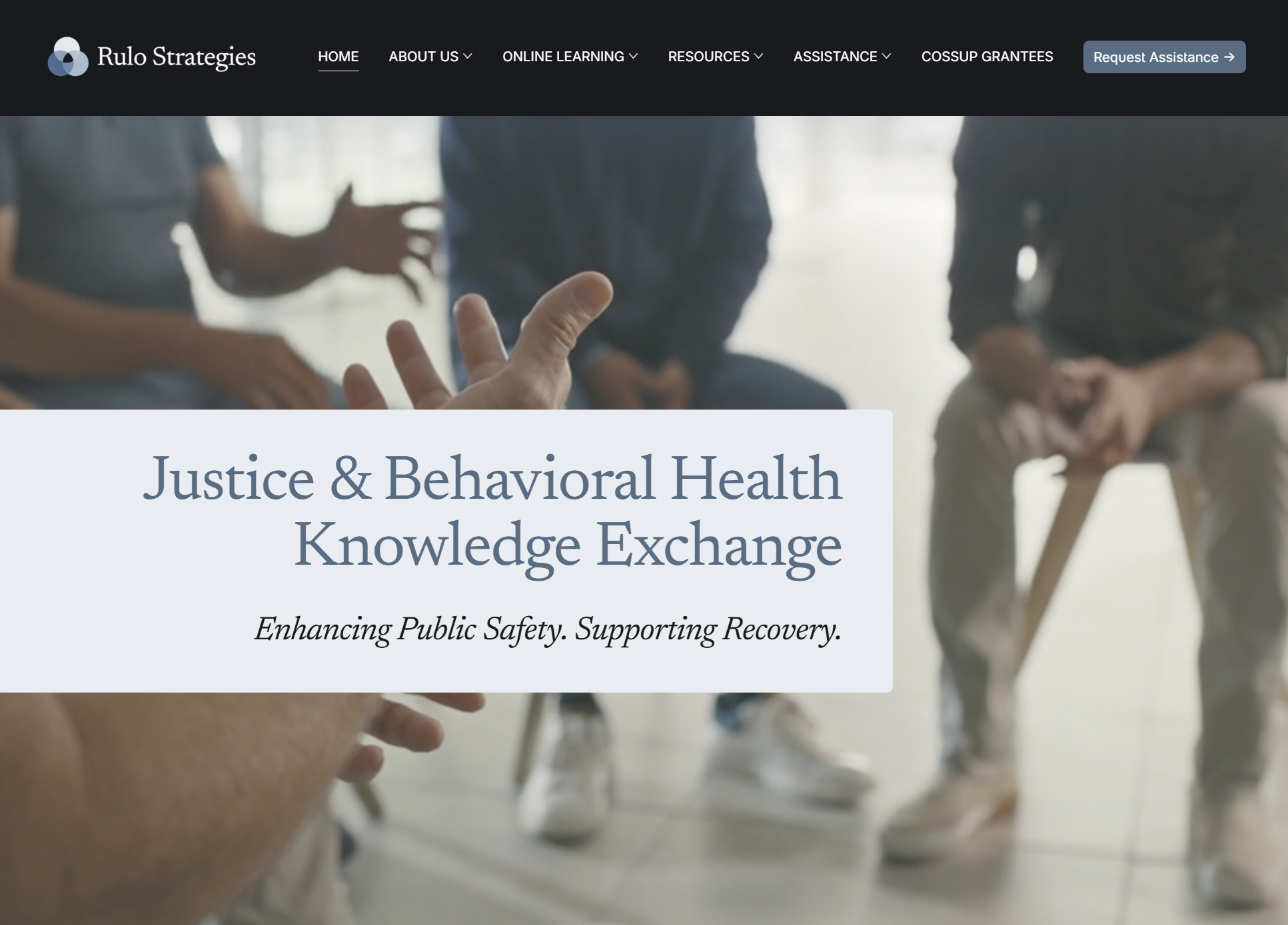 A website homepage for Rulo Strategies with a blurred background image of people in a discussion, and text about justice and behavioral health knowledge exchange.