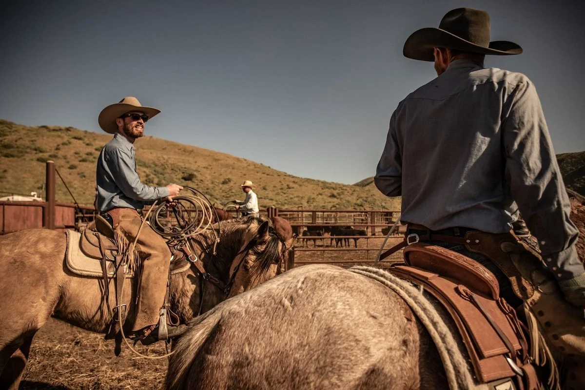 Cowboys Talking on Horseback