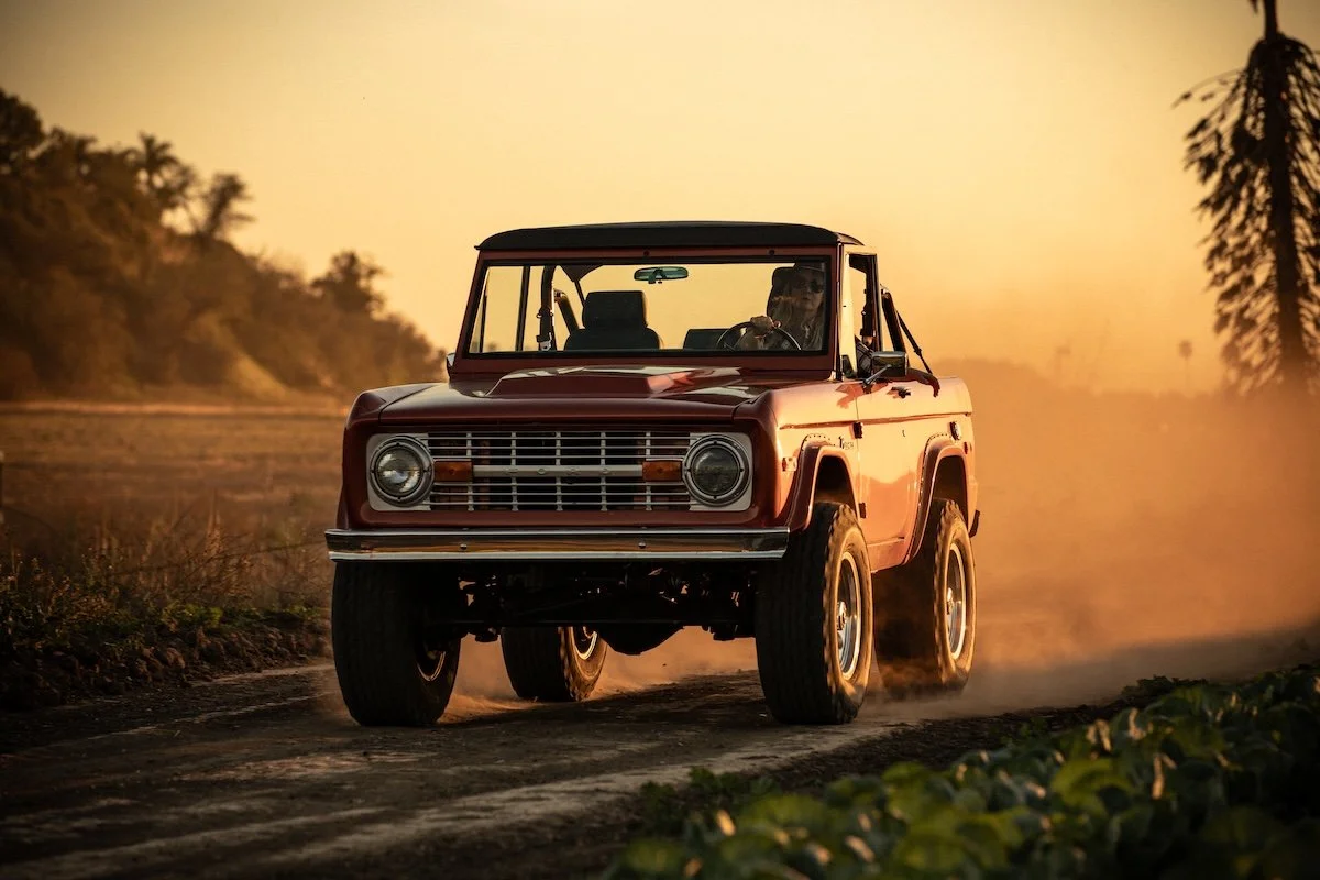 1974 Ford Bronco Driving on Dirt Road