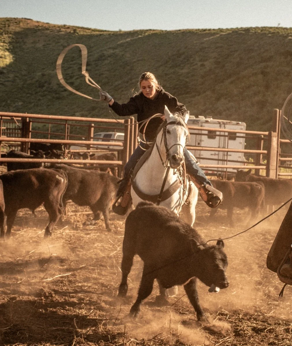 Woman Roping a Calf
