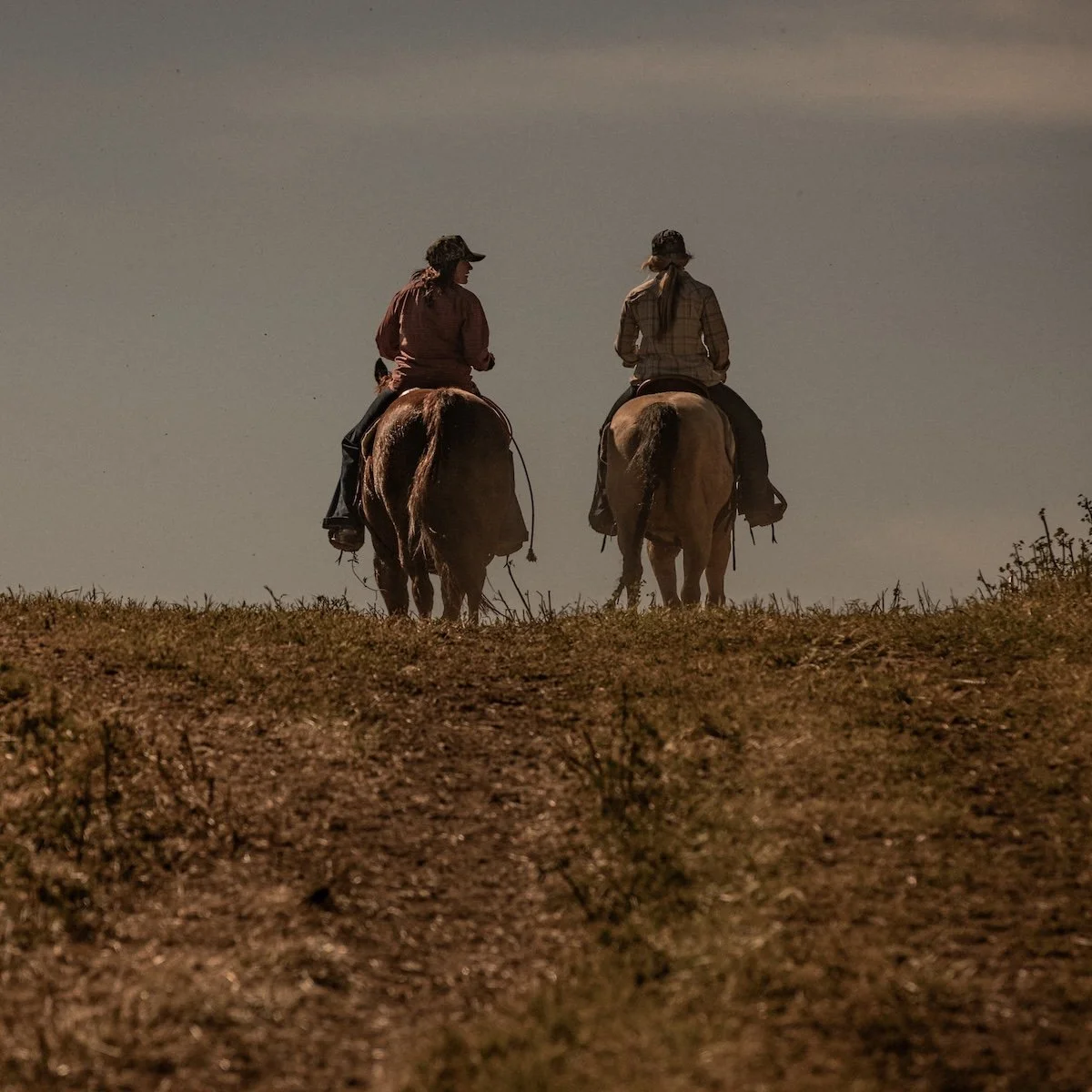 Two Women Riding Horses