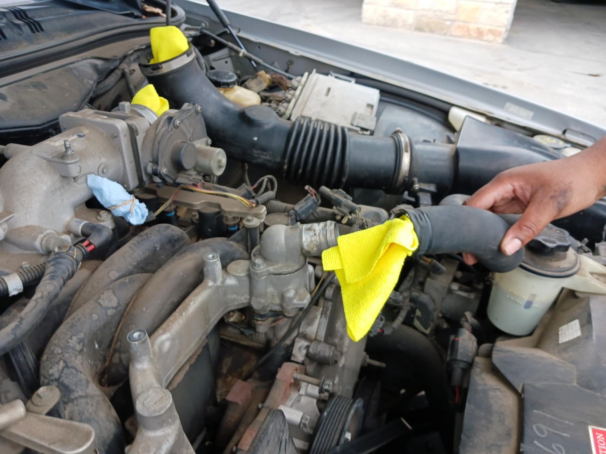 Intake manifold replacement, thermostat and cooling system hose replacements.