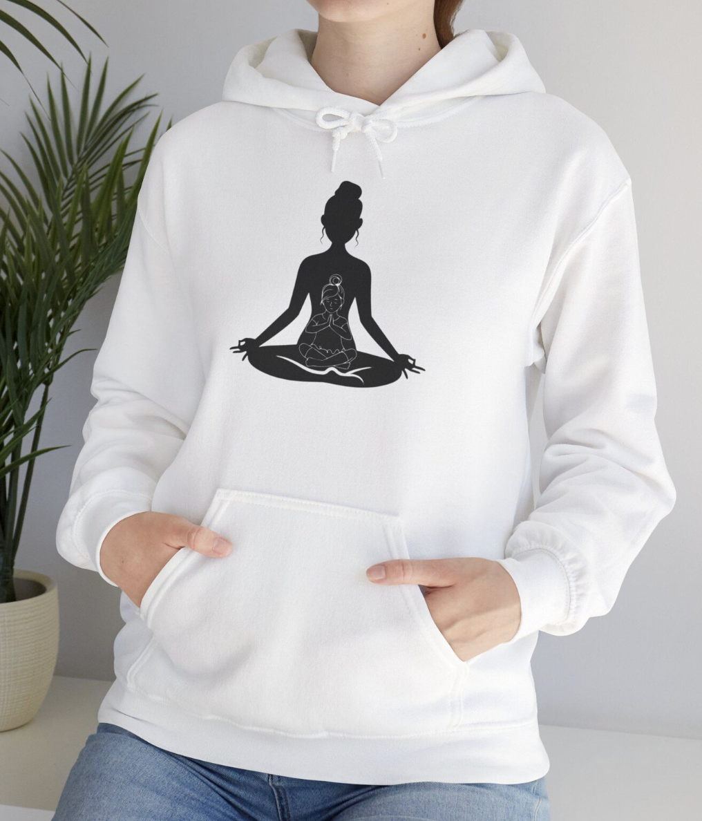White hoodie with a black silhouette of a woman meditating in a lotus position, with a smaller figure sitting on her lap.
