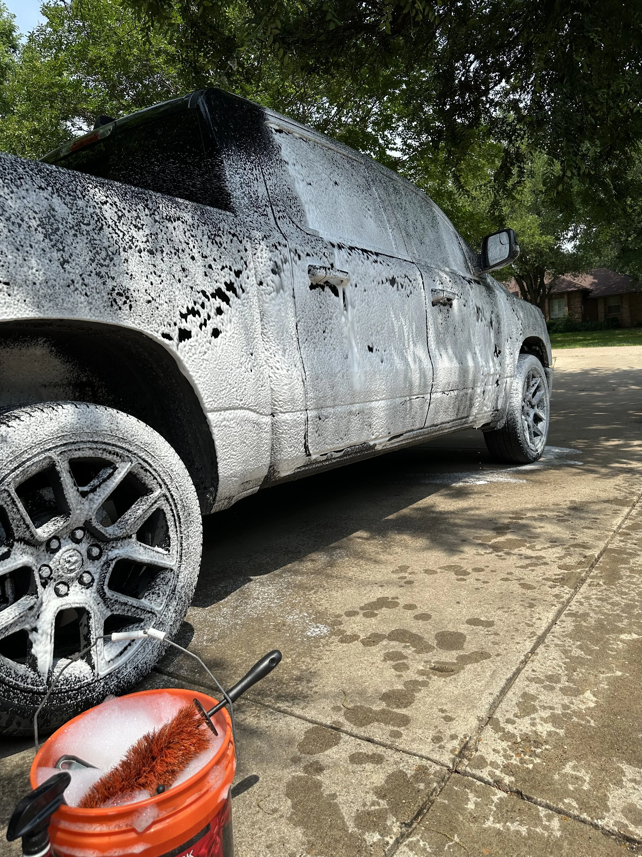 Truck getting sprayed with snow foam during mobile car wash in Midlothian TX