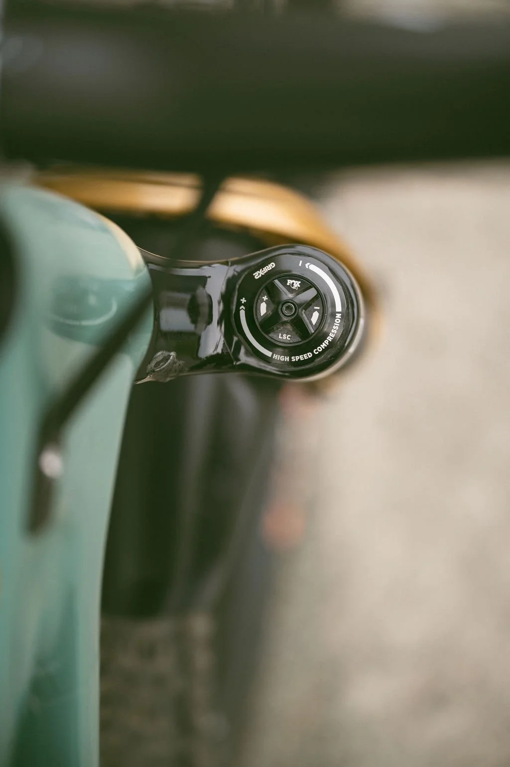 Close-up of a bicycle handlebar with a high-speed compression suspension fork.