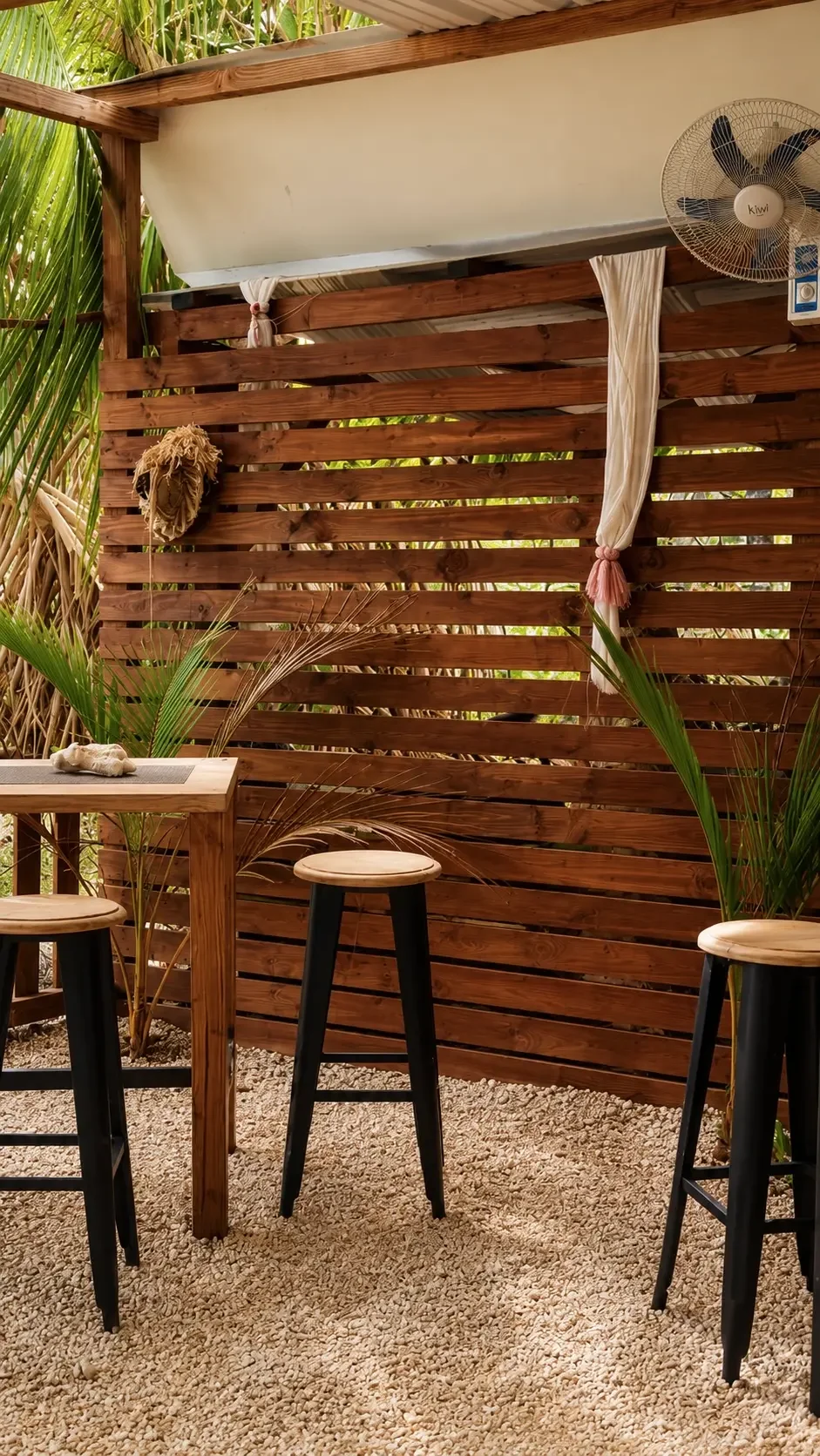 Cozy open-air lounge for sunset drinks in Rangiroa