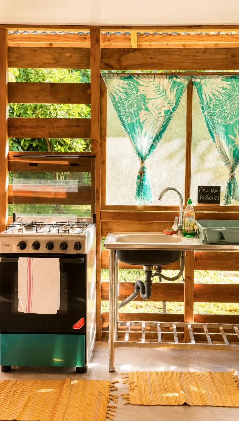 Spacious dorm kitchen at Kura Ora Guest House in Rangiroa
