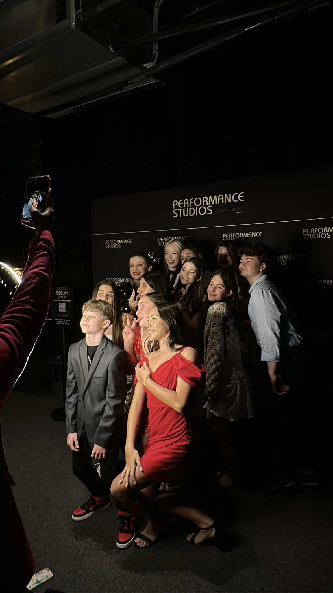 Rise Up Singing Competition at Performance Studios semi finalists posing in front of photo booth at club noir