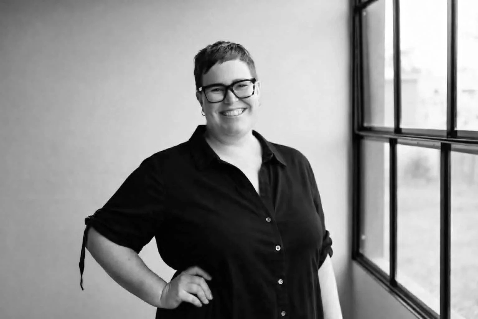 Performance Studios Choir Master Courtney Truce smiling.