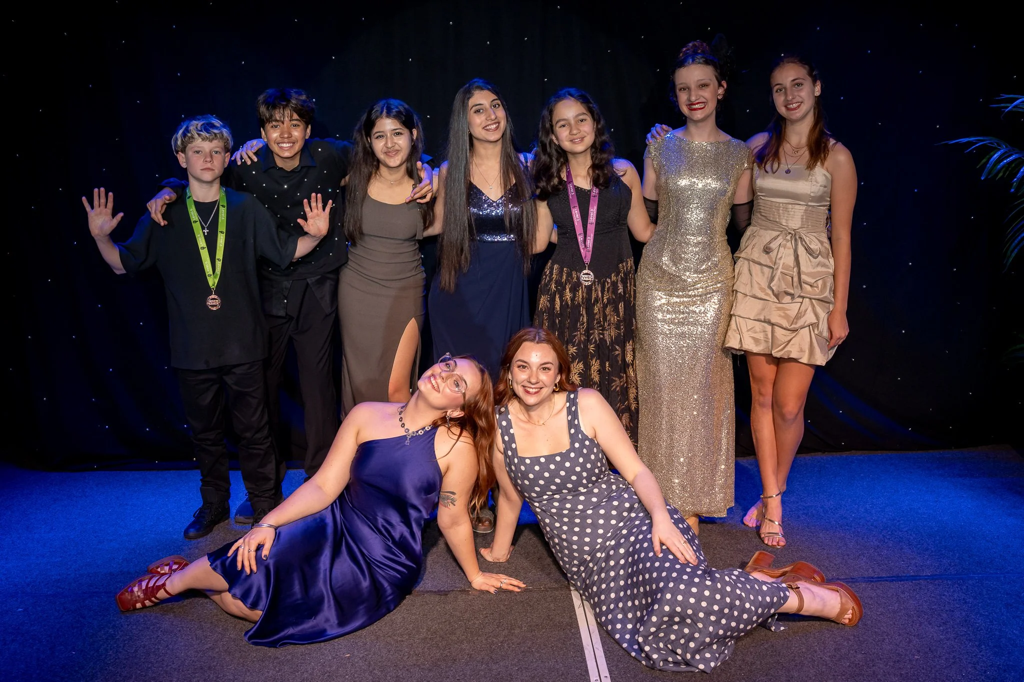 Performance Studios Vocal Coaches Beth Parr and Grace Arnell pose with 2026 Emerging Elite Performance Team.