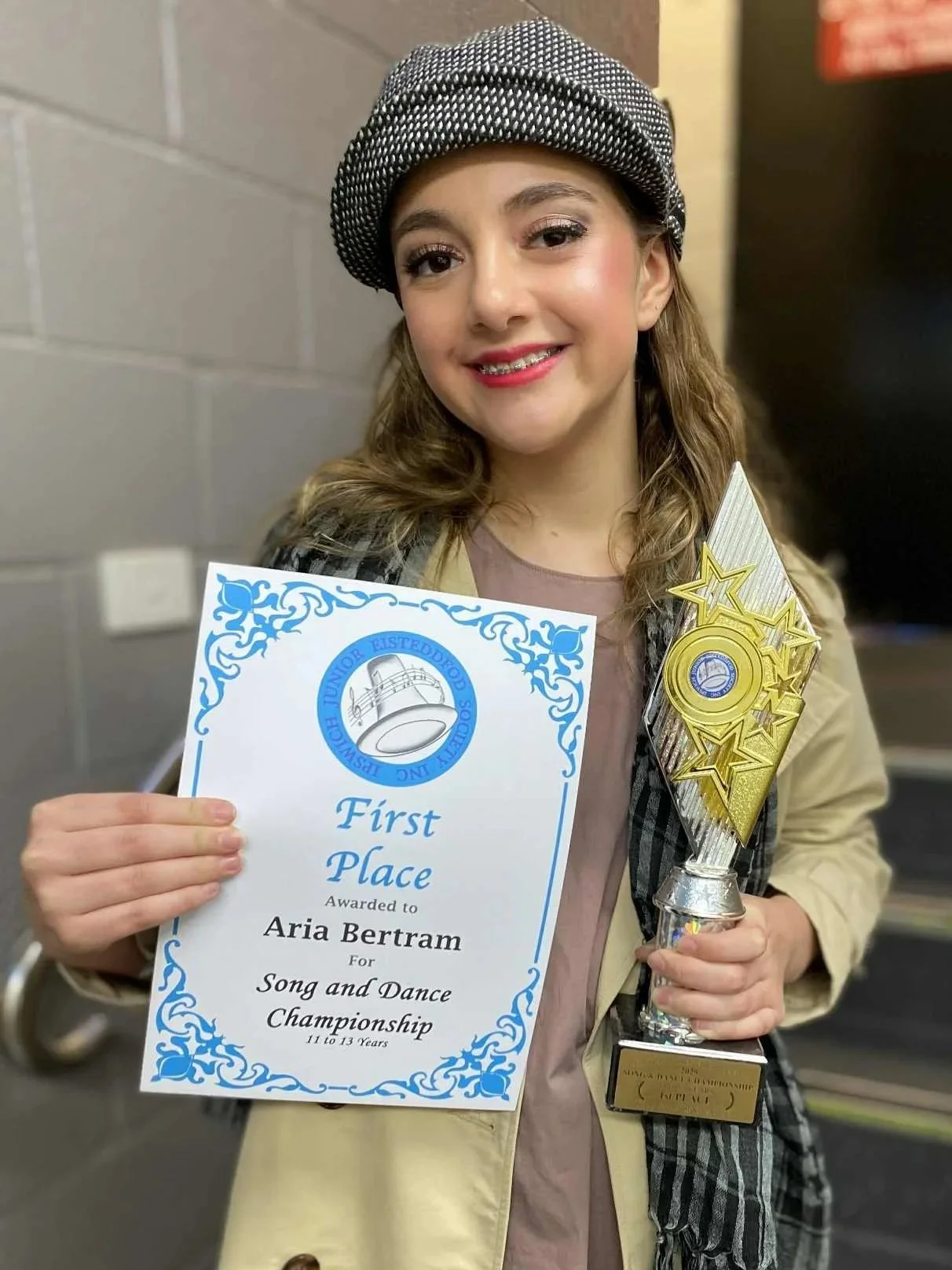 Performance Studios - Lisa Lockland-Bell Singing Teacher Vocal Coach Brisbane, Logan, Gold Coast. Aria Bertram Singing Student smiling with her First Place award at the Ipswich Junior Eisteddfod.