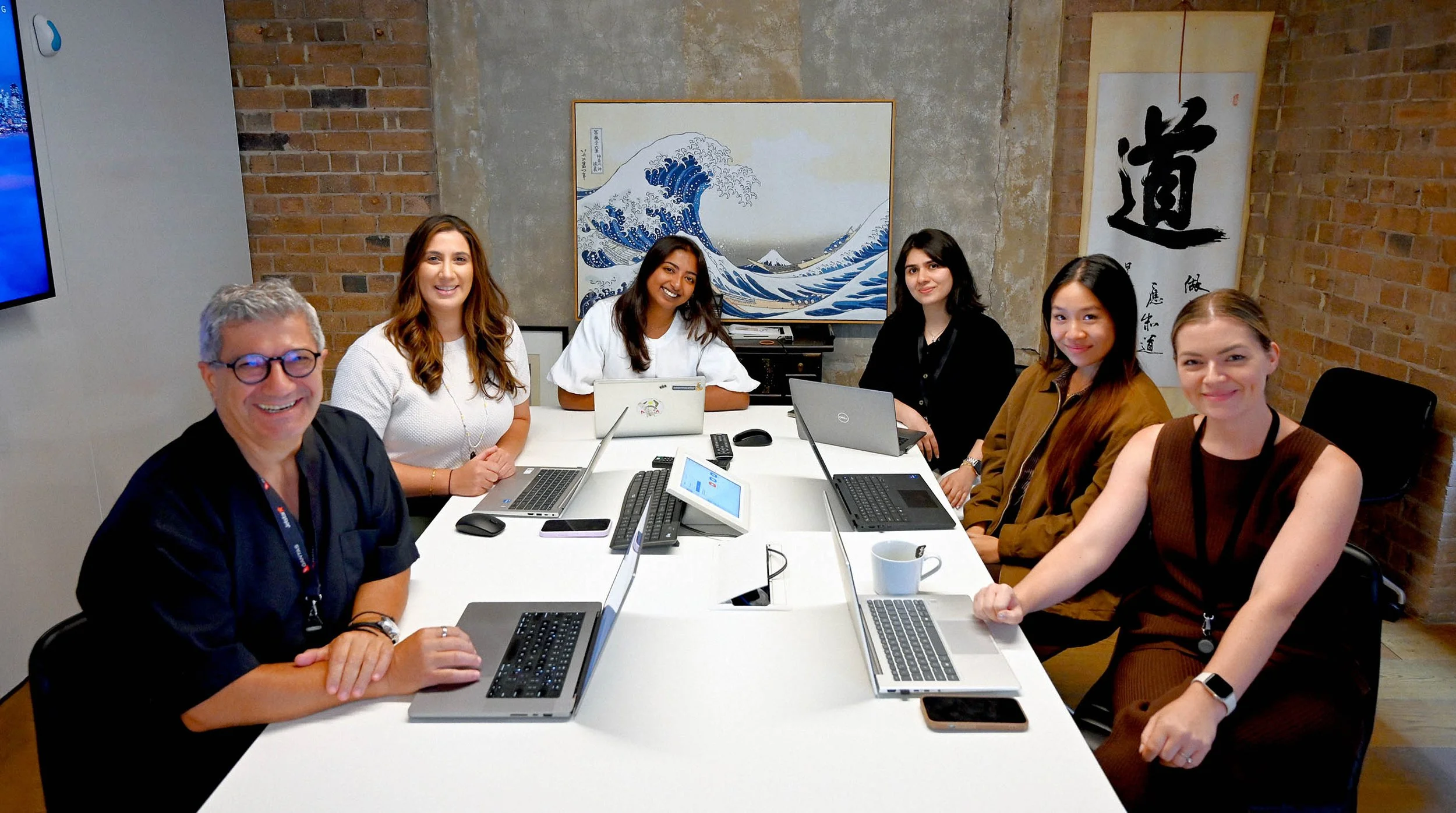 Cultural Perspectives' Communications and Engagement team having a meeting in a meeting room