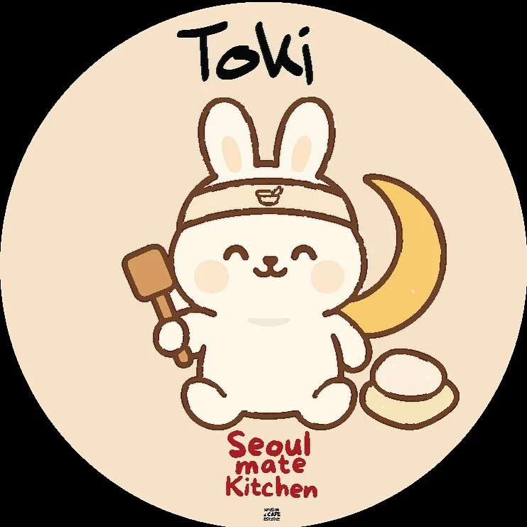 Meet our mascots!

TOKI - your lunar dreamer

Toki the Lunar Dreamer, is a soft, rice cake white bunny whose heart is as full as the moon. Dreamy and poetic, Toki is often found stargazing or gently napping on a cozy piece of mochi, lost in thoughts 