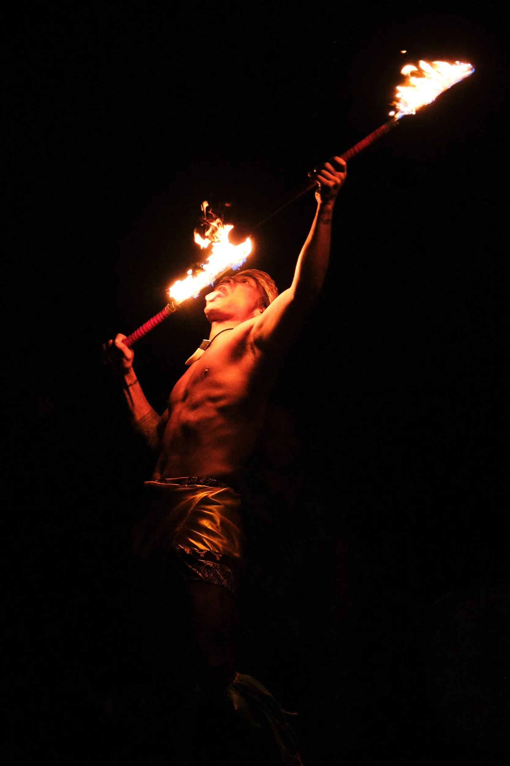 Fire dancer performing at the Andaz luau, Orange County